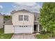 Charming two-story home with a two-car garage and well-maintained lawn and green tree at 2992 Sentiment Ln, Greenwood, IN 46143