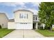 Charming two-story home with a well-manicured lawn and attached two-car garage at 2992 Sentiment Ln, Greenwood, IN 46143