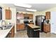 Functional kitchen featuring wooden cabinets, stainless steel appliances, and center island at 2992 Sentiment Ln, Greenwood, IN 46143