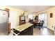 Open-concept kitchen/dining area featuring neutral walls, wooden cabinets, and tiled floors at 2992 Sentiment Ln, Greenwood, IN 46143
