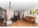 Open-concept living room featuring hardwood floors and a staircase at 2992 Sentiment Ln, Greenwood, IN 46143
