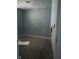 This bedroom has damaged walls and dirty carpet at 335 S Dearborn St, Indianapolis, IN 46201
