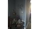 Shows a corner with various forms of damage to the wall and a pile of debris at 335 S Dearborn St, Indianapolis, IN 46201