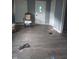 Living room showing damage and debris throughout the property at 335 S Dearborn St, Indianapolis, IN 46201
