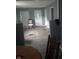 Living room showing damage and debris throughout the property at 335 S Dearborn St, Indianapolis, IN 46201