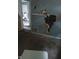 Interior shot shows significant damage to the wall at 335 S Dearborn St, Indianapolis, IN 46201