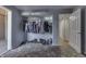 Basement storage area with clothes rack and flooring at 3655 Yellow Poplar Ct, Indianapolis, IN 46222
