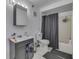 Bathroom with a dark vanity, toilet, shower, and tiled floor at 3655 Yellow Poplar Ct, Indianapolis, IN 46222