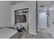 Secondary bedroom with closet, queen-sized bed, and gray walls at 3655 Yellow Poplar Ct, Indianapolis, IN 46222