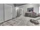 Bedroom featuring a bed, dresser, multiple doorways, and natural light at 3655 Yellow Poplar Ct, Indianapolis, IN 46222
