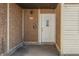 Covered front entrance with white door, exterior light, and mailbox at 3655 Yellow Poplar Ct, Indianapolis, IN 46222