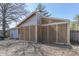 Right side view of the house's exterior showing the cinder block walls and small backyard at 3655 Yellow Poplar Ct, Indianapolis, IN 46222