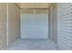 Interior of unfinished garage with cinder block walls and corrugated garage door at 3655 Yellow Poplar Ct, Indianapolis, IN 46222