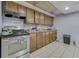 Kitchen with stainless steel oven and wood cabinets at 3655 Yellow Poplar Ct, Indianapolis, IN 46222