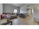 Cozy living room with couch, table, chair and wood laminate flooring at 3655 Yellow Poplar Ct, Indianapolis, IN 46222