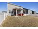 This backyard boasts a covered patio, complemented by a well-maintained lawn and perimeter fencing for added seclusion at 3719 Lexham Ct, Danville, IN 46122