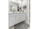 This bathroom showcases a double sink vanity, large mirror, and ample storage space in a modern, functional design at 3719 Lexham Ct, Danville, IN 46122