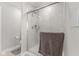 This bathroom shows a glass-enclosed shower, tile surround, and neutral color palette, creating a spa-like experience at 3719 Lexham Ct, Danville, IN 46122