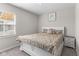 Inviting bedroom with neutral decor, large window, and a comfortable bed, creating a peaceful retreat at 3719 Lexham Ct, Danville, IN 46122