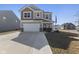 Charming two-story home featuring a covered front porch and an attached two-car garage at 3719 Lexham Ct, Danville, IN 46122