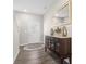 Inviting foyer featuring wood floors, a decorative mirror, and a stylish console table at 3719 Lexham Ct, Danville, IN 46122