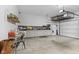 Spacious garage features built in storage, white painted walls and concrete floor at 3719 Lexham Ct, Danville, IN 46122