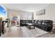 Cozy living room featuring a fireplace, sliding door access to the backyard, and comfortable seating at 3719 Lexham Ct, Danville, IN 46122