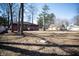 Spacious backyard featuring mature trees, offering both privacy and a blank canvas for outdoor enjoyment at 3813 N Hartman Dr, Indianapolis, IN 46226