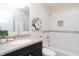 Charming bathroom with a shower-tub, enhanced by a modern vanity and decorative tile accents at 3813 N Hartman Dr, Indianapolis, IN 46226