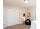 Neutral bedroom with carpet, a black beanbag chair, and a white closet at 3813 N Hartman Dr, Indianapolis, IN 46226