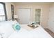 Cozy bedroom featuring soft, inviting bedding and an ensuite bathroom, offering comfort and convenience at 3813 N Hartman Dr, Indianapolis, IN 46226