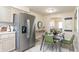 Well lit kitchen with stainless steel appliances and a connected dining area at 3813 N Hartman Dr, Indianapolis, IN 46226