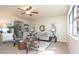 Spacious living room with stylish furnishings, a ceiling fan, and views into other rooms at 3813 N Hartman Dr, Indianapolis, IN 46226