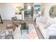 Comfortable living room featuring a stylish rug, modern sofa, and an open layout at 3813 N Hartman Dr, Indianapolis, IN 46226