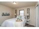 Serene bedroom with soft lighting, plush bedding, and decorative wall art at 3813 N Hartman Dr, Indianapolis, IN 46226