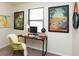 Bright office space with eclectic artwork and a modern chair and desk at 3813 N Hartman Dr, Indianapolis, IN 46226