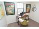 Bright office space with eclectic artwork and a modern chair and desk at 3813 N Hartman Dr, Indianapolis, IN 46226