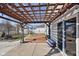 Inviting backyard patio with a wood pergola, perfect for outdoor entertaining and relaxation at 3832 Kilburn Ct, Indianapolis, IN 46228