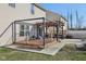 Exterior view features a deck, patio and wood pergola strung with lights at 3832 Kilburn Ct, Indianapolis, IN 46228