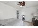 Bedroom with neutral walls, a ceiling fan, and view into the doorway at 3832 Kilburn Ct, Indianapolis, IN 46228