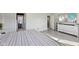 Bedroom with light gray walls, wood-look floors, and a TV mounted on a dresser at 3832 Kilburn Ct, Indianapolis, IN 46228