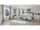 Bright bedroom with a large windows, neutral color palette and a large patterned rug at 3832 Kilburn Ct, Indianapolis, IN 46228