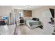 Comfortable bedroom features a wood accent wall, desk, and a full sized bed at 3832 Kilburn Ct, Indianapolis, IN 46228