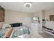 Bright, modern bedroom features a wood accent wall, and a mounted TV at 3832 Kilburn Ct, Indianapolis, IN 46228
