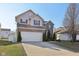 Attractive two-story home with a long driveway and brick and vinyl facade at 3832 Kilburn Ct, Indianapolis, IN 46228