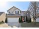 Charming two-story home with a two-car garage and well-manicured landscaping at 3832 Kilburn Ct, Indianapolis, IN 46228