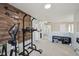 Second floor home gym area including free weights and a wall mounted weight machine at 3832 Kilburn Ct, Indianapolis, IN 46228
