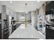 Bright kitchen featuring stainless steel appliances, an island and a sliding glass door to the outside at 3832 Kilburn Ct, Indianapolis, IN 46228