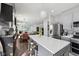 Modern kitchen with stainless steel appliances, a center island, and an open floor plan at 3832 Kilburn Ct, Indianapolis, IN 46228