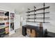 Cozy home office space features custom wood shelving, gray walls, and natural light at 3832 Kilburn Ct, Indianapolis, IN 46228
